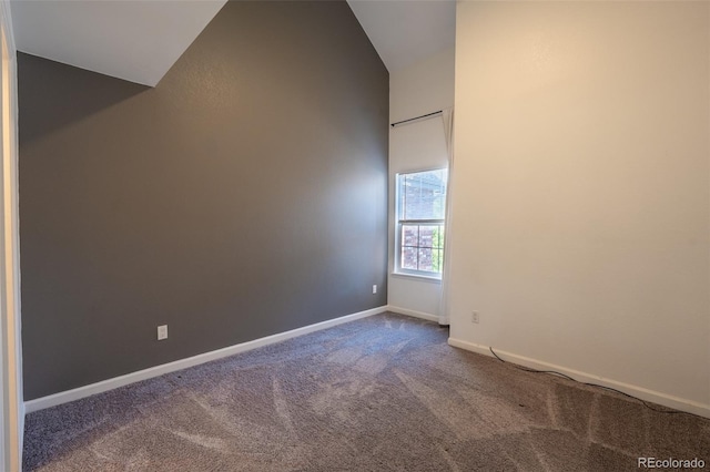 4943 S Carson St Unit 207, Aurora, CO 80015 - carpeted empty room featuring lofted ceiling and baseboards