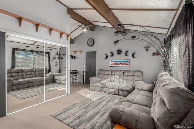 carpeted living area featuring high vaulted ceiling, beam ceiling, a ceiling fan, and a healthy amount of sunlight