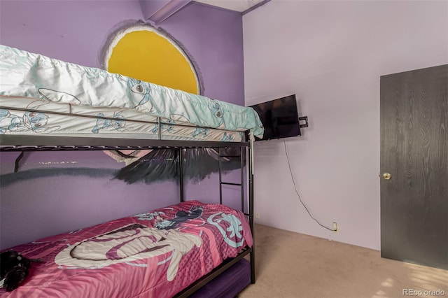 bedroom featuring light carpet