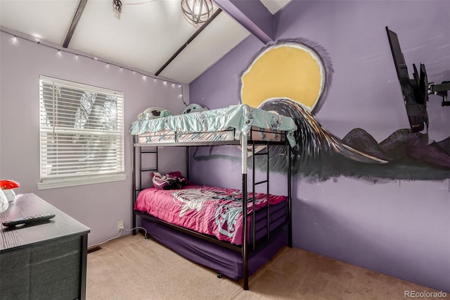 carpeted bedroom with lofted ceiling