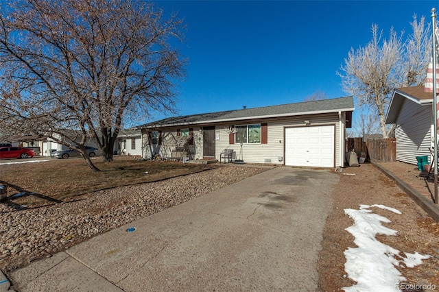 single story home with a garage, driveway, and fence