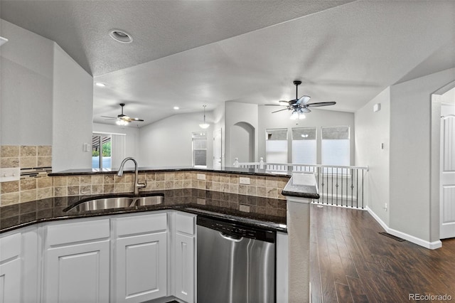 kitchen with white cabinetry, sink, lofted ceiling, dishwasher, and dark hardwood / wood-style flooring