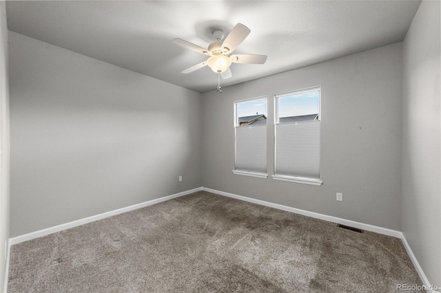 empty room featuring carpet and ceiling fan