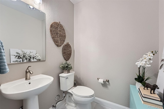 bathroom with sink and toilet