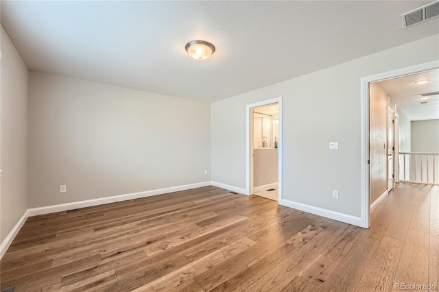 empty room featuring hardwood / wood-style floors