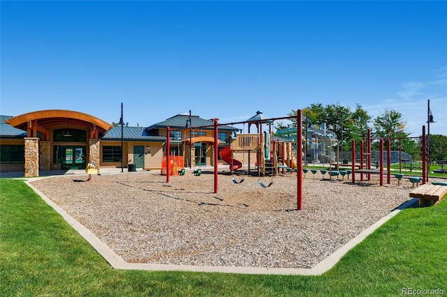 view of playground with a lawn