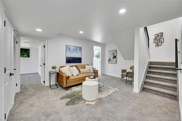 1173 Xenon St, Golden, CO 80401 - living area featuring carpet floors, stairs, baseboards, recessed lighting, and healthy amount of natural light