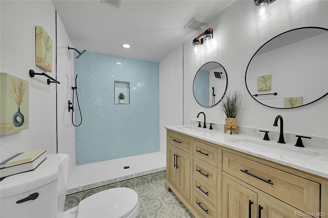 1173 Xenon St, Golden, CO 80401 - full bathroom with toilet, double vanity, walk in shower, and tile patterned floors