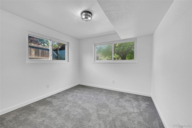 1173 Xenon St, Golden, CO 80401 - carpeted spare room with a textured ceiling and baseboards