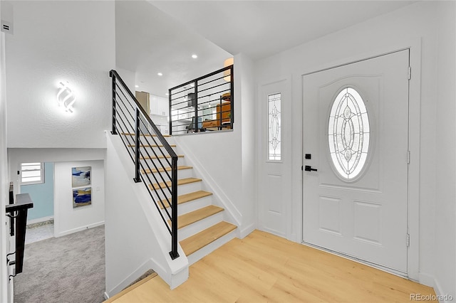 1173 Xenon St, Golden, CO 80401 - foyer featuring baseboards, stairway, light wood-style flooring, and recessed lighting