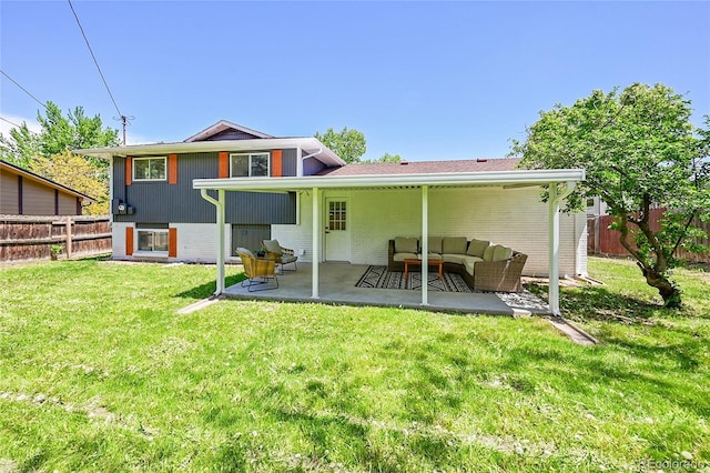 1173 Xenon St, Golden, CO 80401 - back of property featuring a patio area, an outdoor living space, and brick siding