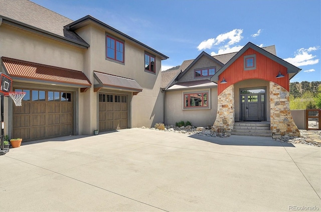 117 River Run Ct, Buena Vista, CO 81211 - view of front of property with driveway, stucco siding, an attached garage, and roof with shingles