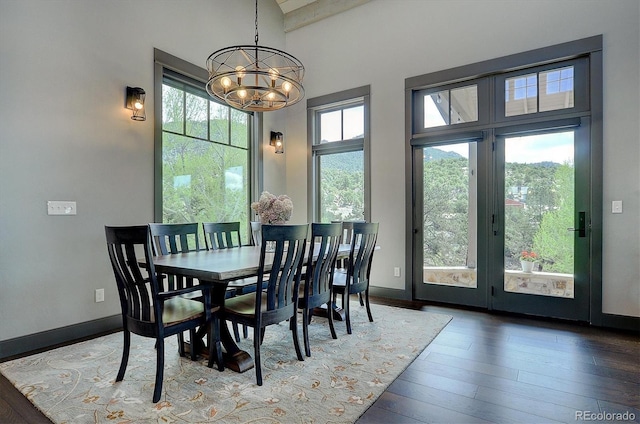 117 River Run Ct, Buena Vista, CO 81211 - dining space with a chandelier, hardwood / wood-style flooring, beam ceiling, and baseboards