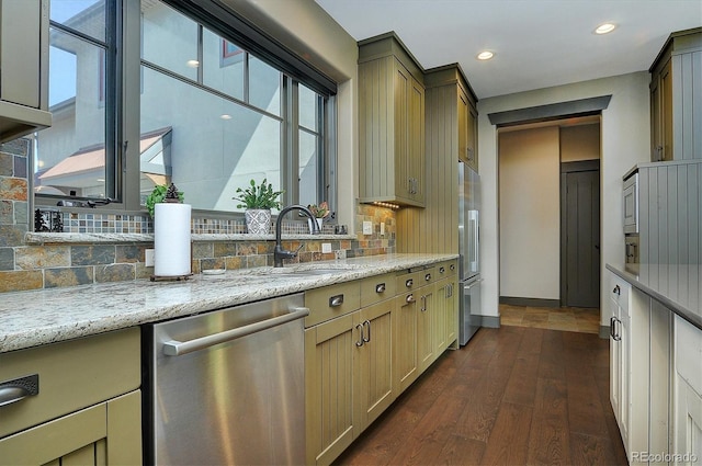 117 River Run Ct, Buena Vista, CO 81211 - kitchen with stainless steel appliances, a sink, decorative backsplash, dark wood-style flooring, and recessed lighting