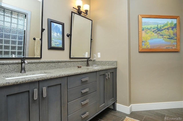 117 River Run Ct, Buena Vista, CO 81211 - bathroom with double vanity and baseboards