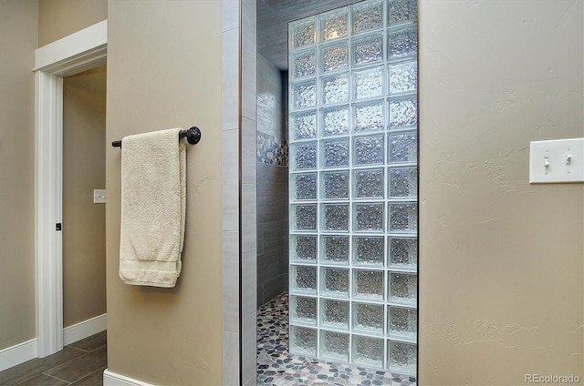 117 River Run Ct, Buena Vista, CO 81211 - bathroom featuring a walk in shower, baseboards, and tile patterned flooring