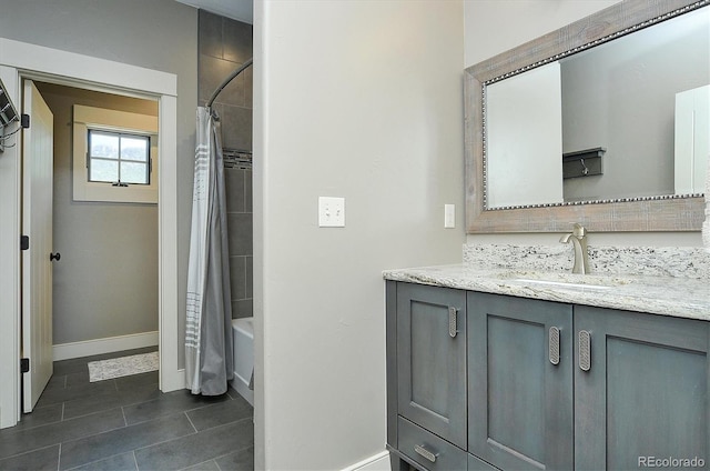 117 River Run Ct, Buena Vista, CO 81211 - full bathroom with baseboards, vanity, tile patterned floors, and shower / bath combo with shower curtain