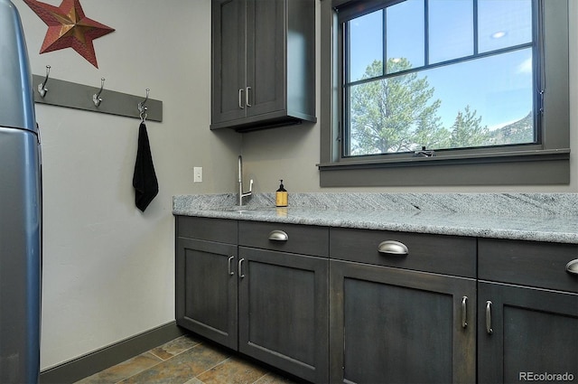 117 River Run Ct, Buena Vista, CO 81211 - indoor wet bar featuring freestanding refrigerator and baseboards