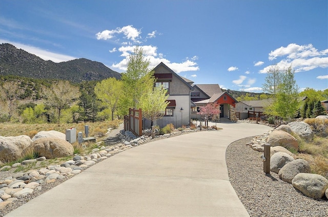 117 River Run Ct, Buena Vista, CO 81211 - view of front facade with a mountain view, stucco siding, and driveway