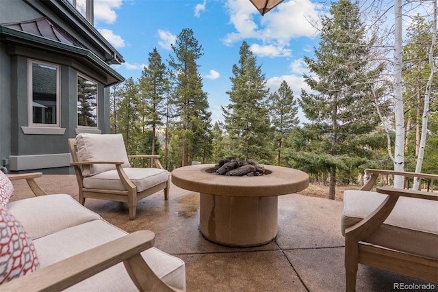 11406 Conifer Ridge Dr, Conifer, CO 80433 - view of patio / terrace with a fire pit