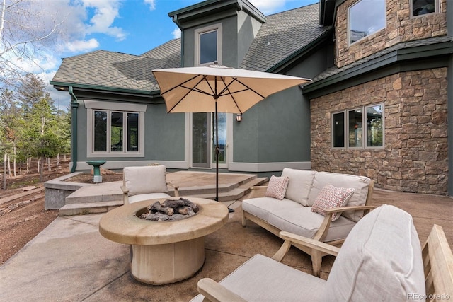 11406 Conifer Ridge Dr, Conifer, CO 80433 - view of patio / terrace with an outdoor living space with a fire pit