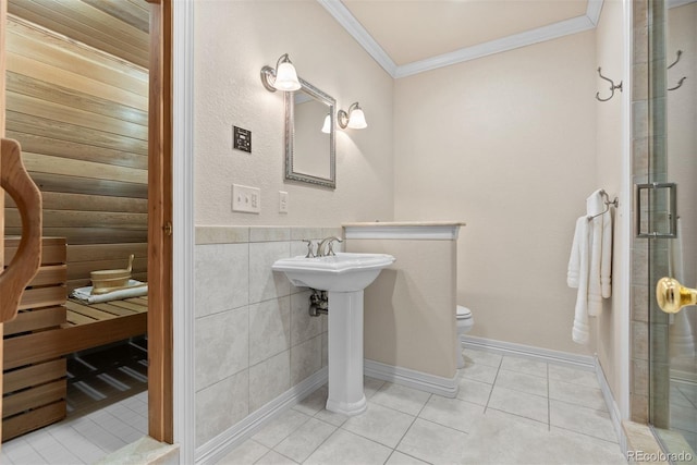 11406 Conifer Ridge Dr, Conifer, CO 80433 - full bath featuring crown molding, toilet, tile patterned floors, a shower stall, and tile walls