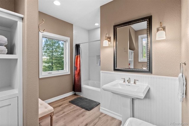11406 Conifer Ridge Dr, Conifer, CO 80433 - full bathroom featuring shower / tub combo, wood finished floors, a wainscoted wall, and recessed lighting
