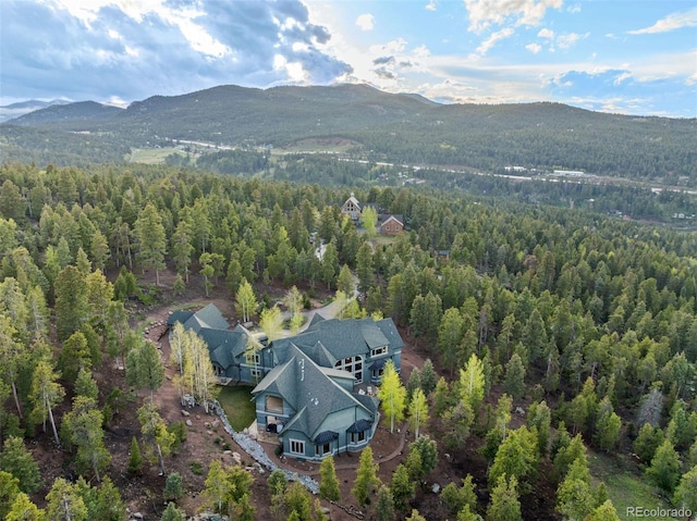 11406 Conifer Ridge Dr, Conifer, CO 80433 - aerial view of property and surrounding area featuring a forest and a mountain backdrop