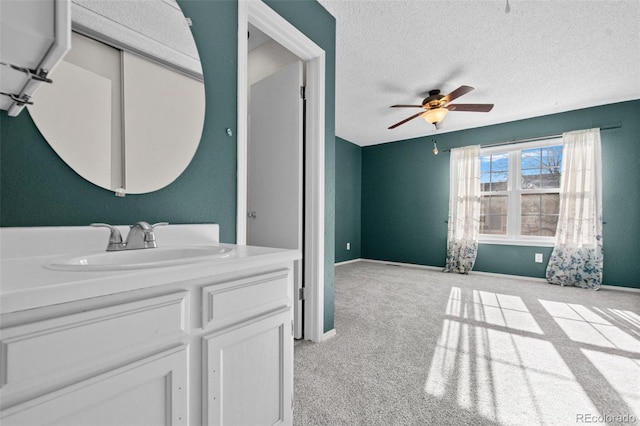 bathroom featuring vanity, a textured ceiling, and ceiling fan