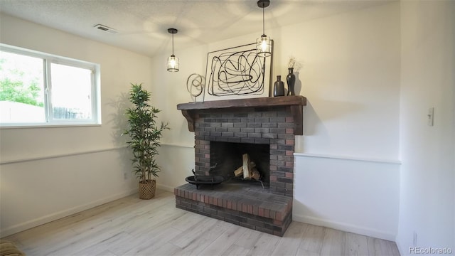 13833 W 68th Ave, Arvada, CO 80004 - detailed view of wood finished floors, a fireplace, and baseboards