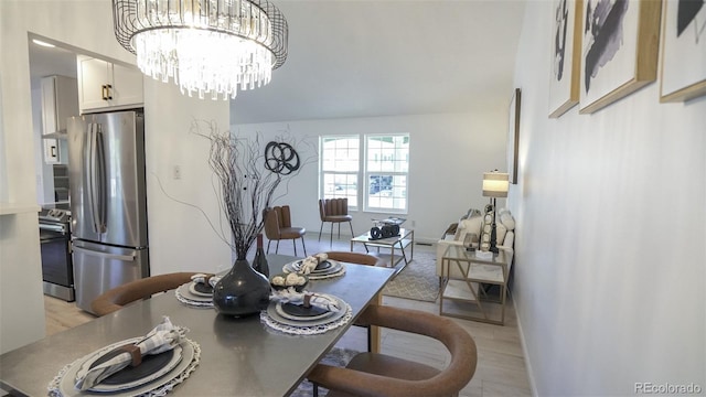 13833 W 68th Ave, Arvada, CO 80004 - dining room featuring baseboards and a chandelier