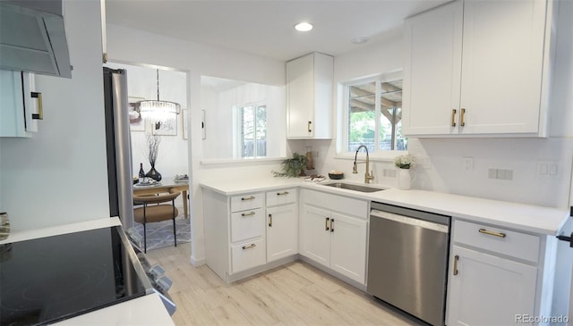 13833 W 68th Ave, Arvada, CO 80004 - kitchen featuring dishwasher, a sink, light wood finished floors, white cabinetry, and recessed lighting