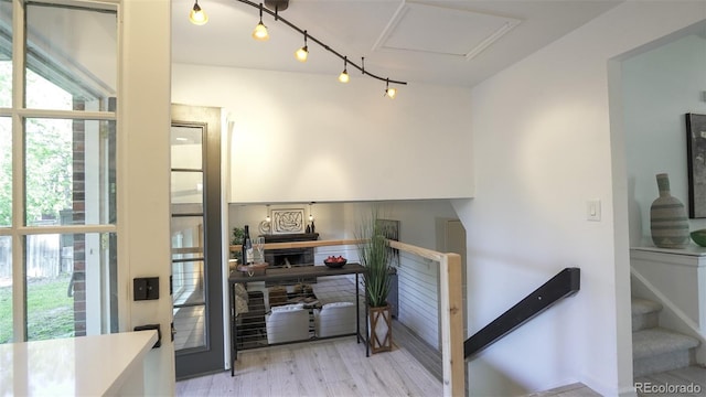 13833 W 68th Ave, Arvada, CO 80004 - stairway featuring wood finished floors and attic access