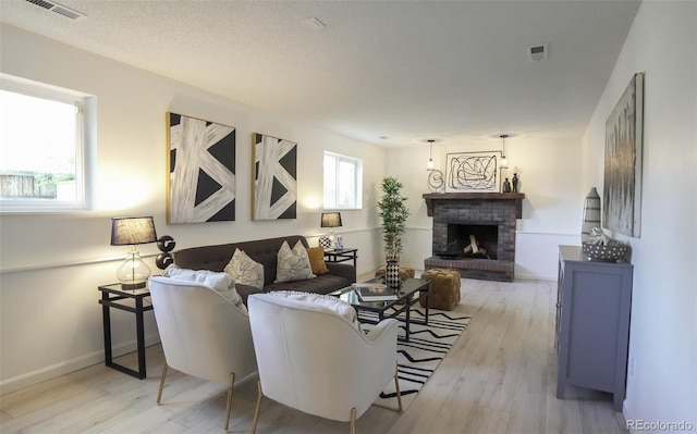13833 W 68th Ave, Arvada, CO 80004 - living room featuring wood finished floors, a fireplace, and baseboards