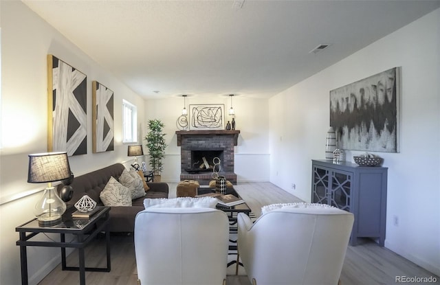 13833 W 68th Ave, Arvada, CO 80004 - living room with wood finished floors and a fireplace