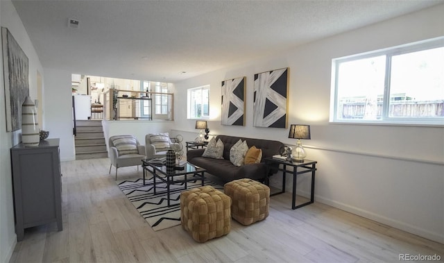 13833 W 68th Ave, Arvada, CO 80004 - living room with wood finished floors, stairs, and baseboards