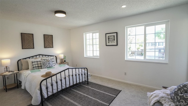 13833 W 68th Ave, Arvada, CO 80004 - bedroom with carpet, a textured ceiling, and baseboards
