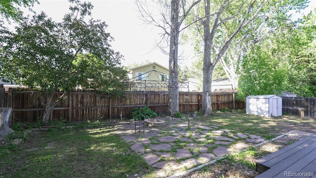 13833 W 68th Ave, Arvada, CO 80004 - fenced backyard with a fire pit and a patio