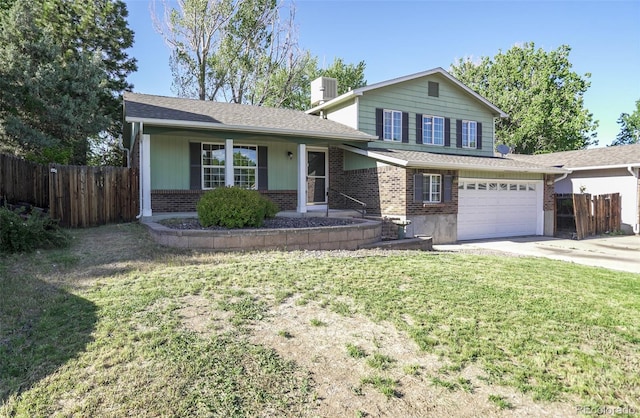 13833 W 68th Ave, Arvada, CO 80004 - tri-level home featuring brick siding, concrete driveway, a chimney, an attached garage, and central AC unit