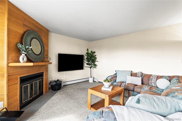 carpeted living room featuring a large fireplace, a textured ceiling, and baseboard heating