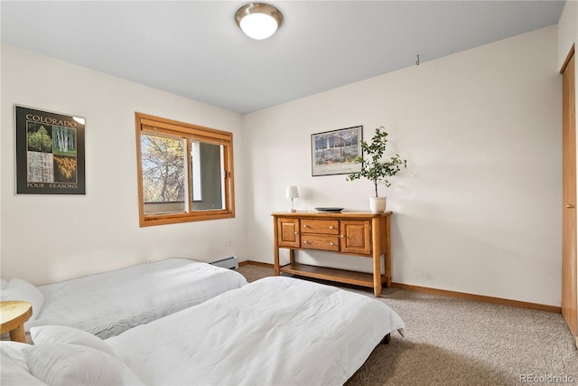 carpeted bedroom with baseboard heating