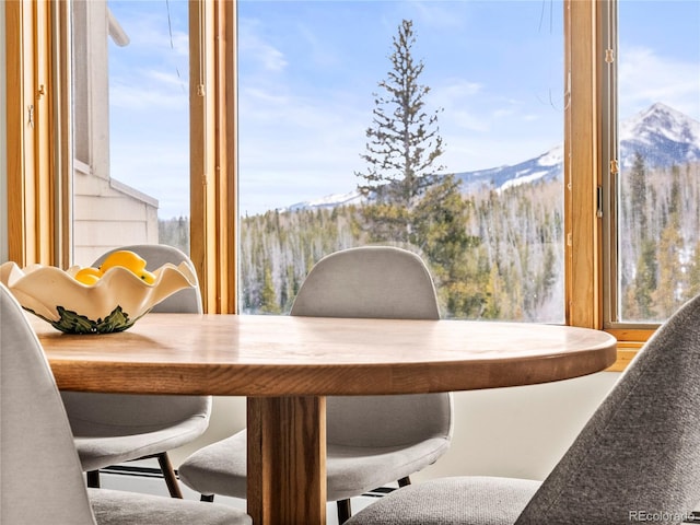 dining room featuring a mountain view