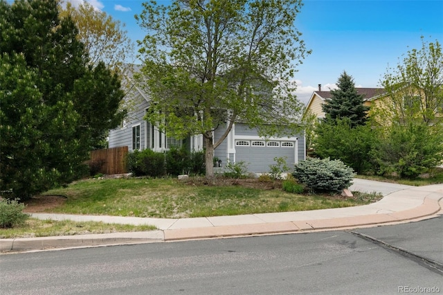 3618 Boot Spur Ct, Colorado Springs, CO 80922 - obstructed view of property featuring an attached garage