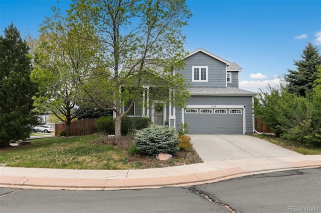 3618 Boot Spur Ct, Colorado Springs, CO 80922 - traditional home with a garage, concrete driveway, and a shingled roof