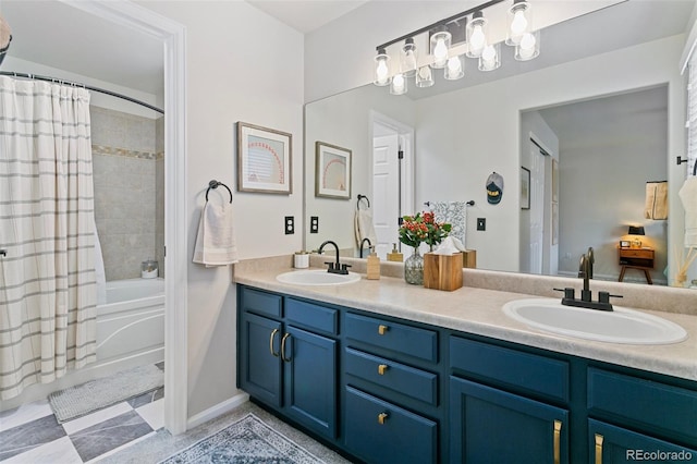 3618 Boot Spur Ct, Colorado Springs, CO 80922 - bathroom with double vanity, shower / tub combo with curtain, and baseboards