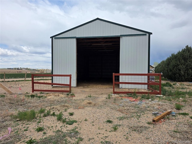 view of pole building with fence