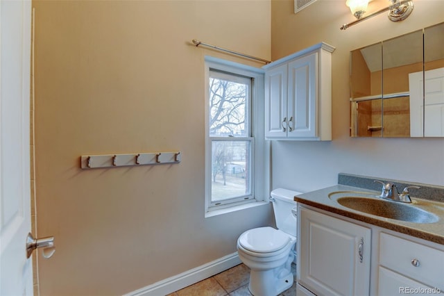 bathroom with walk in shower, tile patterned floors, toilet, and vanity