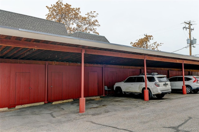 view of vehicle parking with a carport