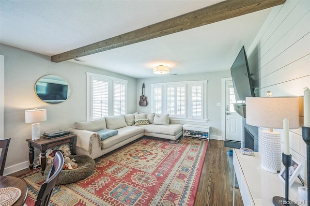 7340 W 32nd Ave, Wheat Ridge, CO 80033 - living area with beamed ceiling and dark wood-style flooring