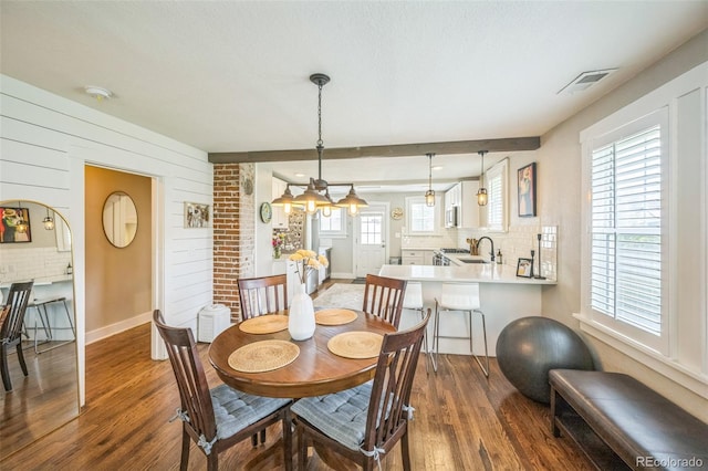 7340 W 32nd Ave, Wheat Ridge, CO 80033 - dining area with dark wood-style floors and baseboards